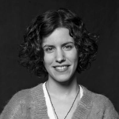 A black and white portrait photo of Hilary Greenbaum.