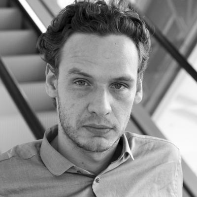 A black and white portrait photo of Ilya Ruderman.