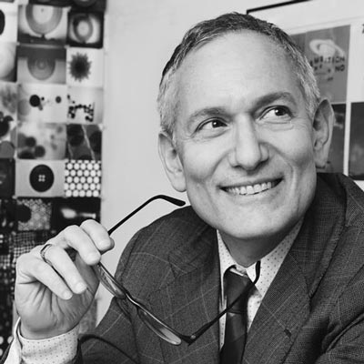 A black and white portrait photo of Martin Venezky.